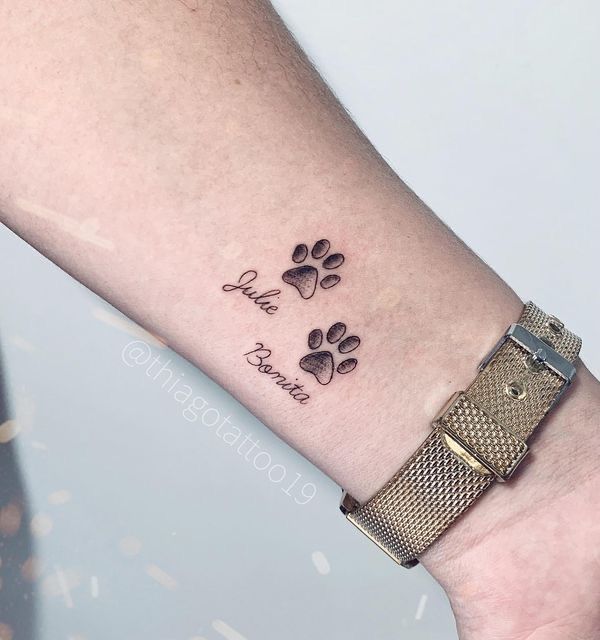 a dog paw tattoo on the wrist