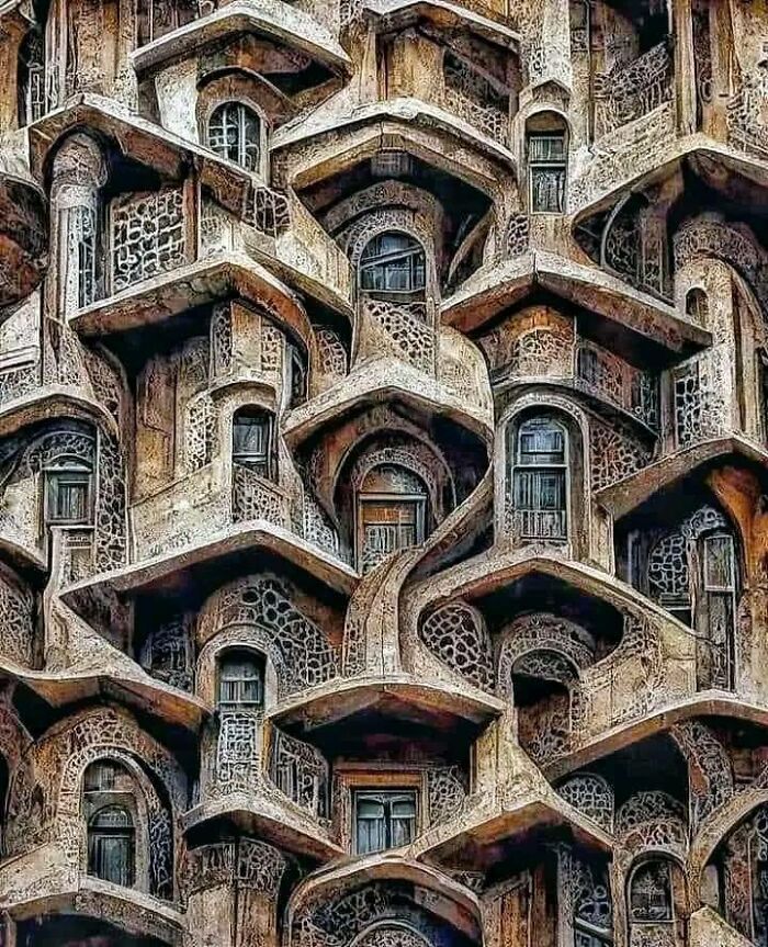 an intricately designed building with windows and balconies