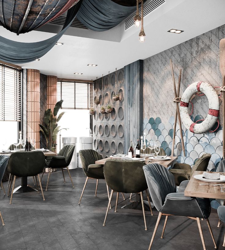 a restaurant with wooden tables and chairs in front of a wall decorated with marine themed tiles