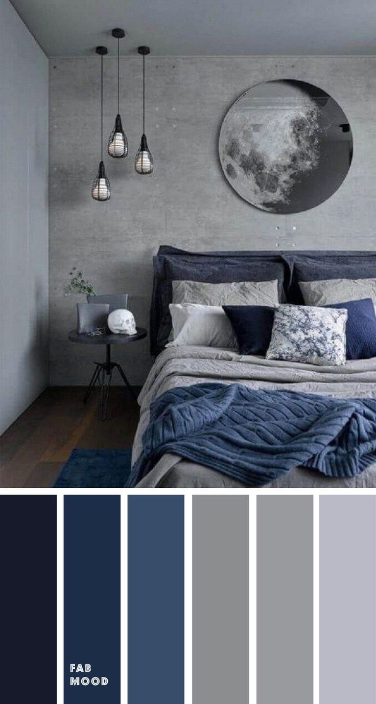 a bedroom with gray walls and blue bedding