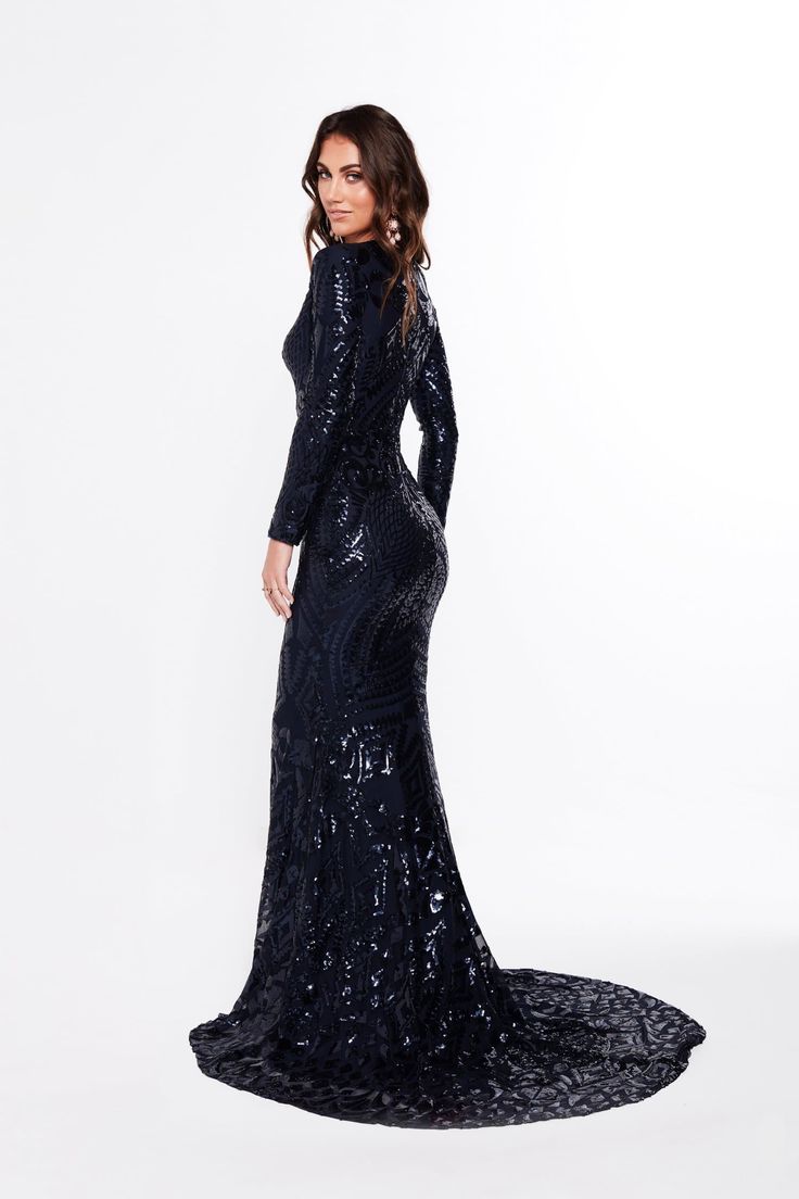 The Julieta is an elegant long sleeve sequins gown. It is made with beautiful geometric fabric and has a lot of stretch to it. The features on this gown are an elegant v neckline, long sleeve and a small mermaid train. The material is quite stretchy and there is an exposed back zipper. What is a Made-To-Order? This product is a made-to-order item. Made-to-order items are not held in physical stock and production commences AFTER order placement. We try to limit production and stock levels and as Long Sleeve Sequin Gala Dress, Glamorous Long Sleeve Sequin Formal Dress, Long Sleeve Embellished Gown For Night Out, Elegant Long Sleeve Dress With Sequins For Formal Occasions, Long Sleeve Evening Dress For Fall Gala, Fall Long Sleeve Evening Dress For Gala, Fall Long Sleeve Gala Evening Dress, Glamorous Long Sleeve Sequin Dress For Gala, Elegant Long Sleeve Sequin Dress For Night Out