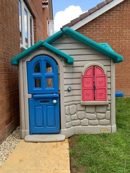 two little houses made to look like they are outside