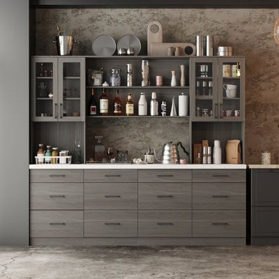 a kitchen with lots of counter space and cabinets on the wall, including an oven