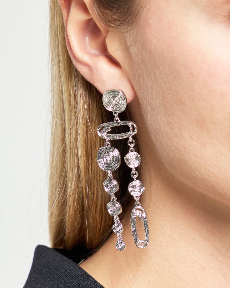 Product Details Add a unique touch to your jewelry collection with our Circular Chain Drop Earrings. These abstract and dangly earrings are the perfect statement piece for any outfit. With a stud closure, they are both stylish and secure. - Push back drop earrings- Material: Silver Style# F24JEWZ041 Fit Notes - Product measures approximately 8 cm Due to the nature of this product, all sales are final. We will replace broken items when possible or offer a replacement for items damaged during shipping. Returns, refunds, or replacement products for reasons other than damage incurred during shipping cannot be accepted. Modern Sterling Silver Clip-on Earrings For Formal Events, Luxury Drop Clip-on Earrings For Statement Piece, Luxury Modern Sterling Silver Clip-on Earrings, Black Nickel-free Drop Chandelier Earrings, Unique Nickel-free Sterling Silver Chandelier Earrings, Dangly Earrings, Silver Drop Earrings, Statement Pieces, Silver Fashion