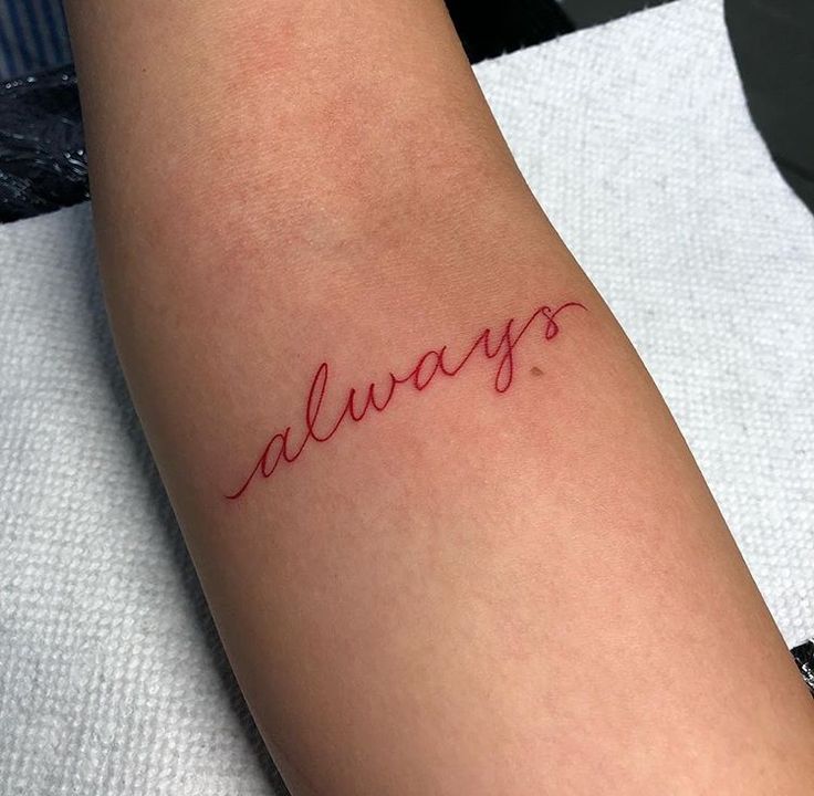 a woman's arm with the word always written in cursive writing on it