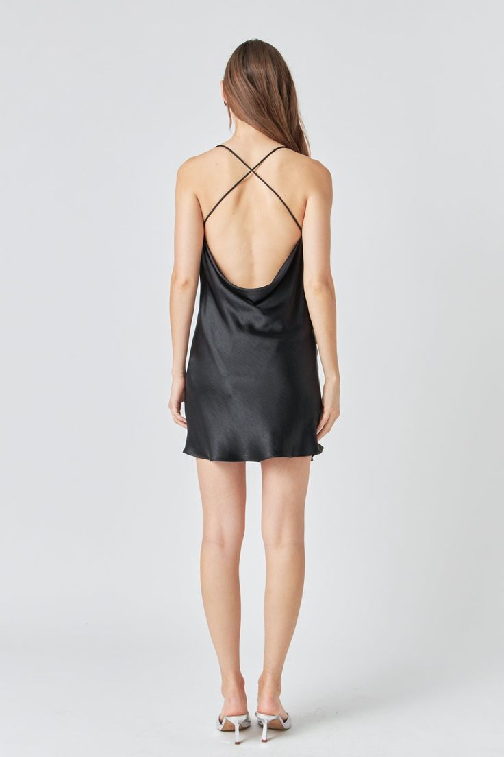 We're obsessing over this Cowl Neck Mini Dress with X-Back! With a stylish cowl neckline and an cross back design, this mini dress is perfect for any event. Unlined and mini length, this dress is sure to turn heads. Add some statement earrings and heels to complete the look. Cowl neckline X-back Unlined Mini length Hand wash cold Do not bleach Do not tumble dry Iron low Shell: 100% Polyester Lining: 100% Polyester TL352D Total length: 32", Bust: 35.50" XS BLACK: Height 5'9" / Bust 30.5" / Waist Sleek Tie-back Dress For Date Night, Sleek Tie Back Dress For Date Night, Sleek Tie-back Dress For Night Out, Sleek Tie Back Dress For Night Out, Summer Backless Dress With Cowl Back For Night Out, Summer Backless Cowl Back Dress For Night Out, Summer Cowl Back Backless Dress For Night Out, Flirty Mini Dress With Back Opening, Chic Dresses With Ruched And Cross Back