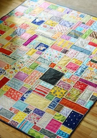 a multicolored patchwork rug on the floor