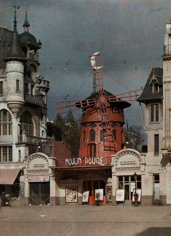 an old building with a windmill on top