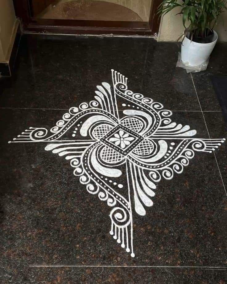 an intricately designed floor in the middle of a room with a potted plant