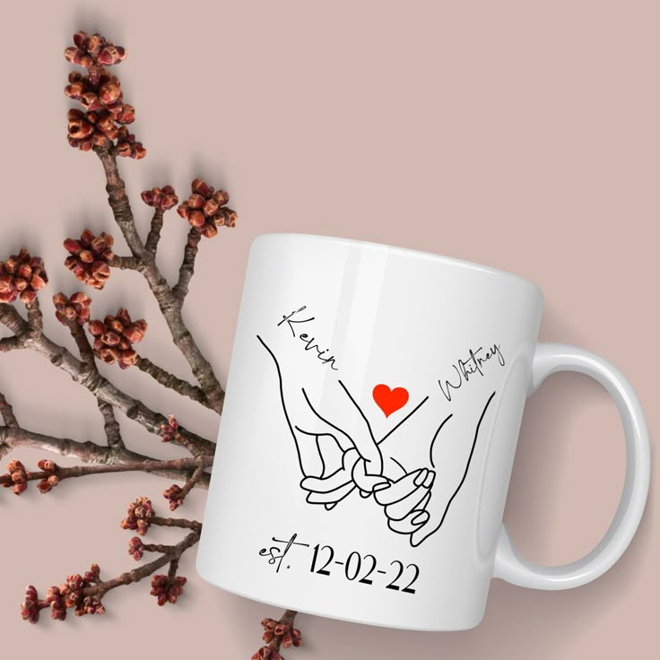 a coffee mug with two hands holding each other's hand and the words, i love you written on it