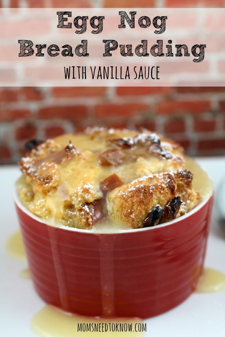 an egg nog bread pudding with vanilla sauce in a red casserole dish