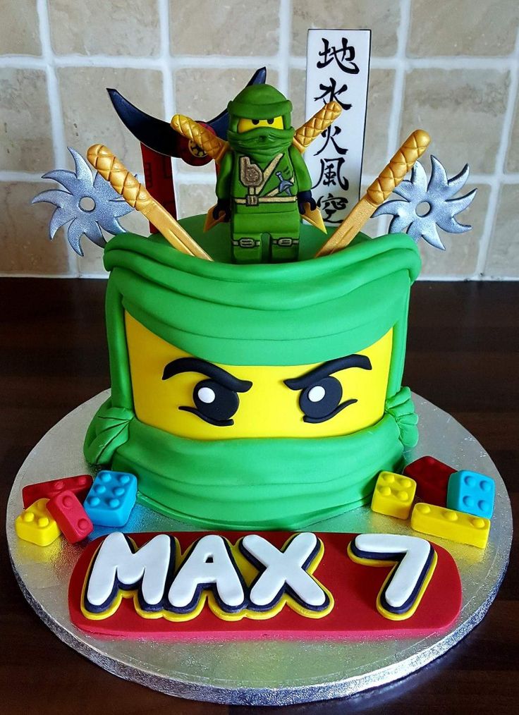 a birthday cake made to look like a lego character