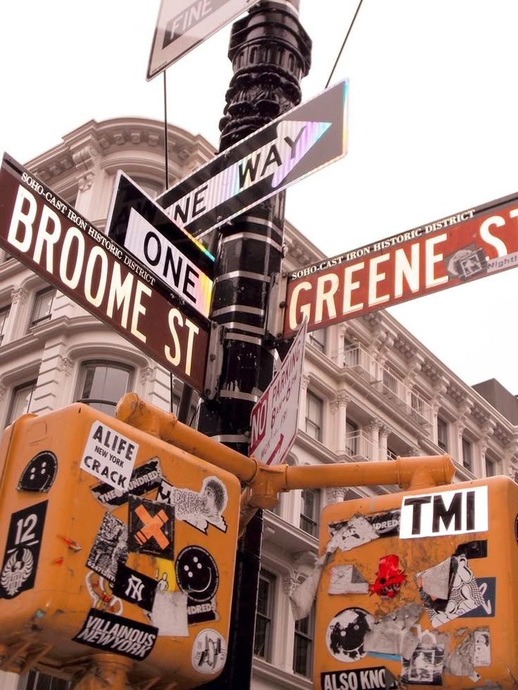 the street signs are clearly visible for everyone to see on this pole in new york city