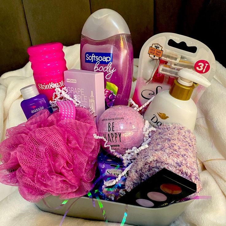 a basket filled with personal care items on top of a bed