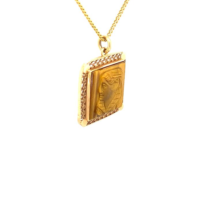 FREE shipping on all orders! FREE 5 Day Returns! Learn More. MACHLI the late Queen of Ranthambore, was India's most famous and most photographed tigers. She was a ferocious fighter just like you! Honor her when you wear this beautiful 14K gold, curb chain, one-of-a-kind, vintage necklace adorned with a bezel set carved tiger's eye cameo left facing profile set into an openwork pendant. The necklace length is 18" long with a spring ring closure. The tiger's eye center stone is 15.00mm x 15.00mm. Luxury Collectible Medallion Necklace, Gold Necklaces With Square Pendant For Formal Occasions, Gold Necklace With Square Pendant For Formal Occasions, Vintage Yellow Gold Necklace With Square Pendant, Vintage Yellow Gold Necklace With Rectangular Pendant, Vintage Yellow Gold Square Pendant Necklace, Gold Square Pendant Jewelry Collectible, Gold Rectangular Pendant Necklace For Collectors, Gold Rectangular Pendant Necklace Collectible