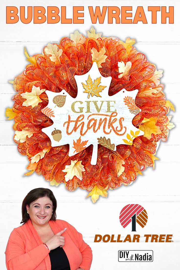 a woman standing in front of a wreath with the words give thanks