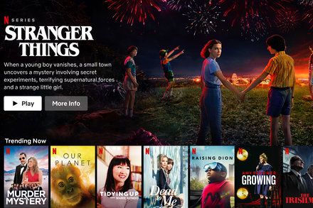 the website for netflix shows an image of people holding hands with fireworks in the background