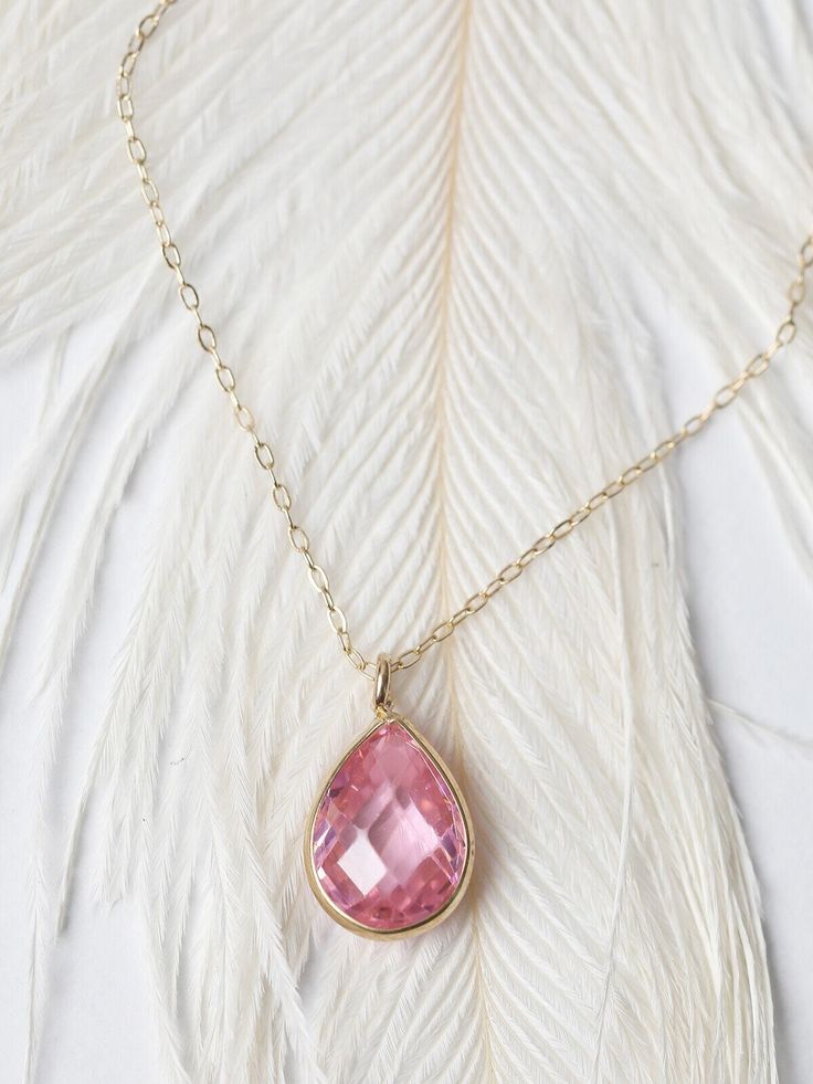 "Get Extra 5% off when you put your item in their cart! CODE: \"MOTHERDAYDEALS\" Pink Sapphire Teardrop Necklace/ Pear Shaped Pink Zircon Pendant/ Faceted Pink Sapphire Necklace/ Everyday Necklace/ Birthday Gift This beautiful, classic solitaire 10 x6mm pear shaped stone is the epitome of understated elegance. The wearer of this exquisite piece is sure to be the envy of everyone in the room with this sparkling pendant that can be worn everyday. Features * Made to Order *Gold KT: 14K Solid Gold * Pink Sapphire Necklace, Pink Zircon, Necklace Everyday, Solid Gold Chains, Gold Heart Necklace, Everyday Necklace, Teardrop Necklace, Solid Gold Jewelry, Sapphire Necklace