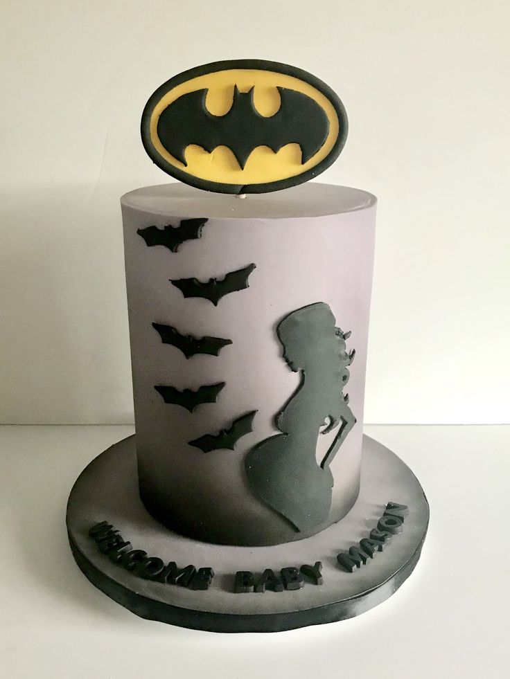 a batman themed birthday cake on a white table