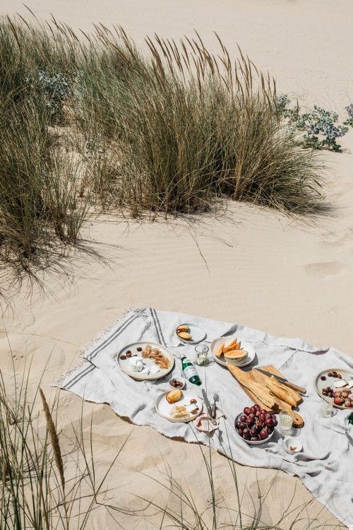 an instagram photo with food on the beach and sand dunes in the background, as well as text that reads instagram