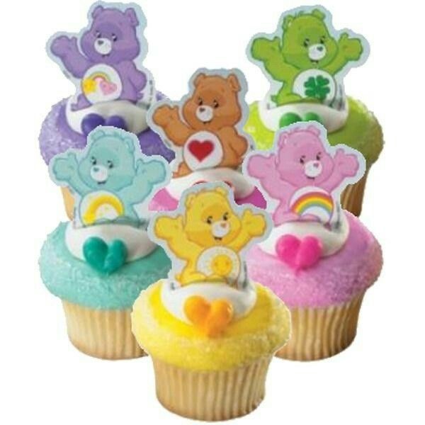 cupcakes decorated with teddy bears and rainbow frosting