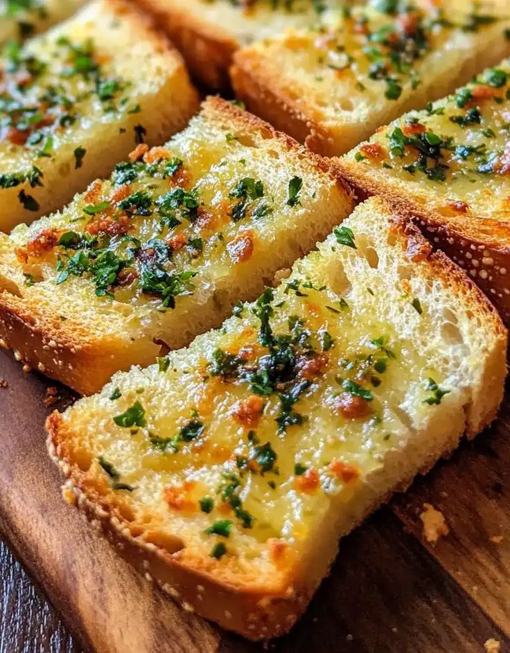 slices of garlic bread on a cutting board