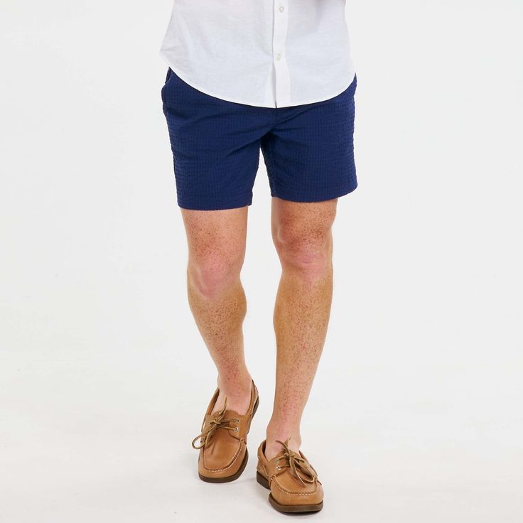 Product Description Your new go-to summer shorts. Tailored for both comfort and sophistication, these lightweight shorts feature a hint of stretch for maximum mobility. Whether you're enjoying a leisurely day out or attending a formal gathering, make a statement with these premium shorts that effortlessly blend versatility and refinement. Product Features Elastic waist with drawstring closure One Button-through Back Pocket Two Side-Seam Hand Pockets Correct 6" inseam for shorter men Slim-fit des Navy Bermuda Shorts For Summer, Navy Bottoms With Short Inseam For Summer, Navy Bermuda Bottoms For Summer, Navy Shorts For Spring With Short Inseam, Navy Spring Shorts With Short Inseam, Navy Shorts With Short Inseam For Spring, Casual Summer Bermuda Shorts For Business, Casual Bermuda Shorts For Business In Summer, Summer Business Casual Bermuda Shorts