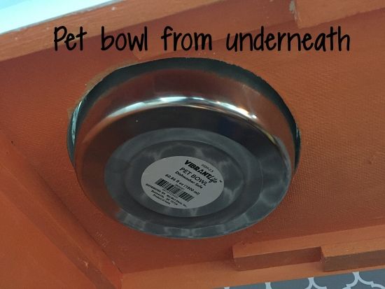 there is a metal bowl on the ceiling with a label that says pet bowl from underneath