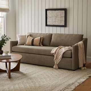 a living room scene with focus on the couch