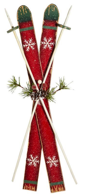 two red skis with snowflakes on them sitting next to each other in front of a white background