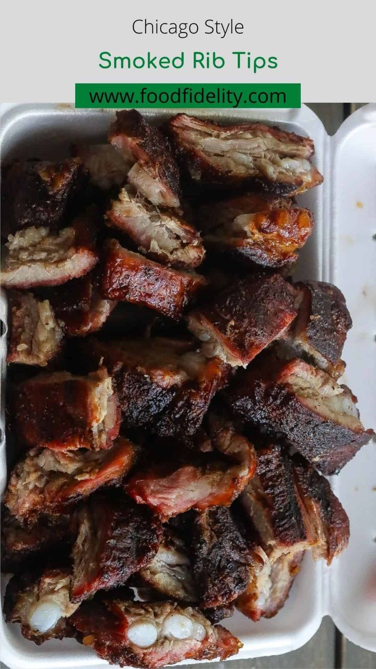 barbecued ribs in a white container with the title chicago style smoked rib tips on top