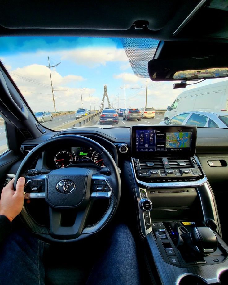 a person driving a car on the road