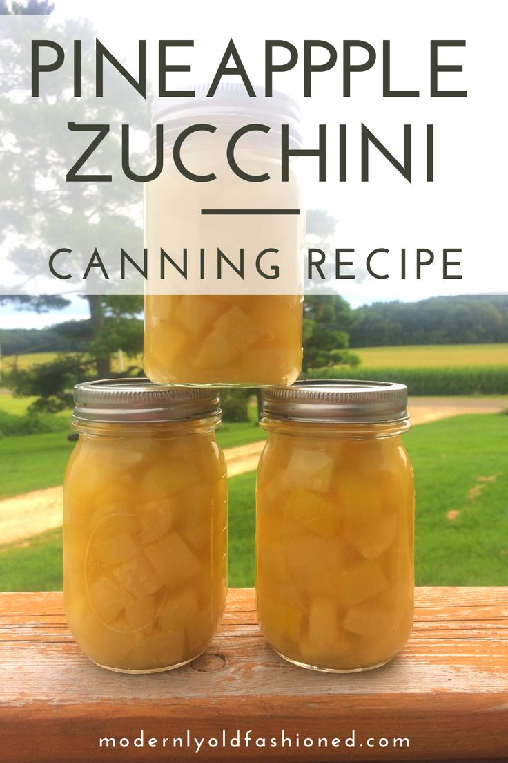 three jars filled with pineapple zucchini sitting on top of a wooden table