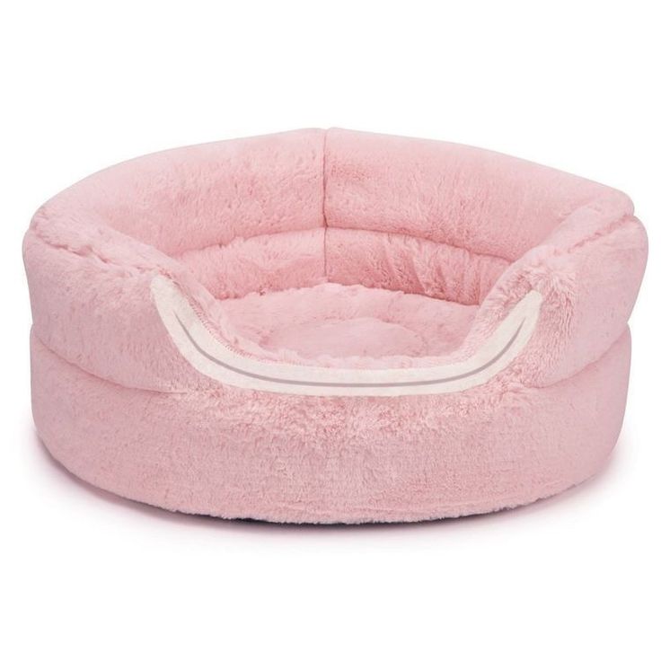 a pink dog bed with white trim