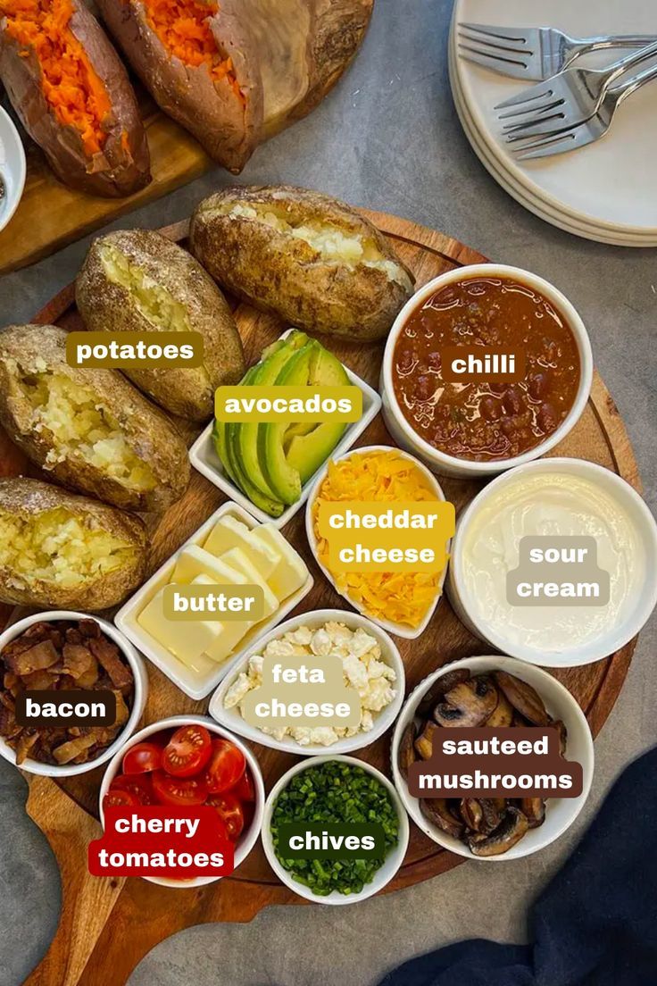 a wooden platter filled with different types of food