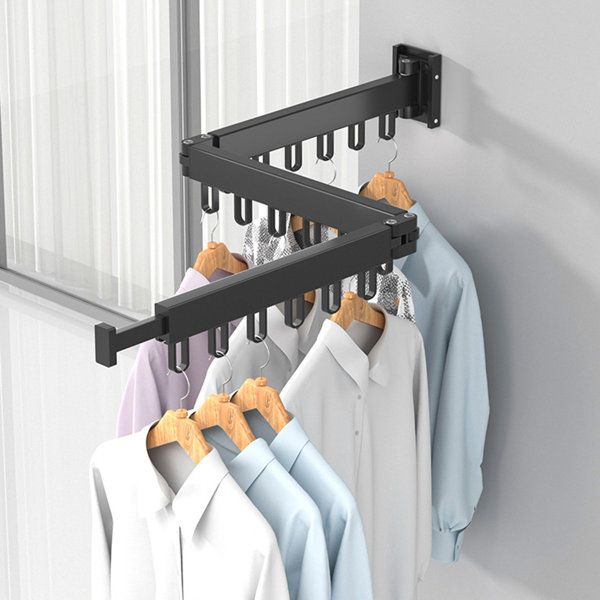 there is a rack with clothes hanging on it