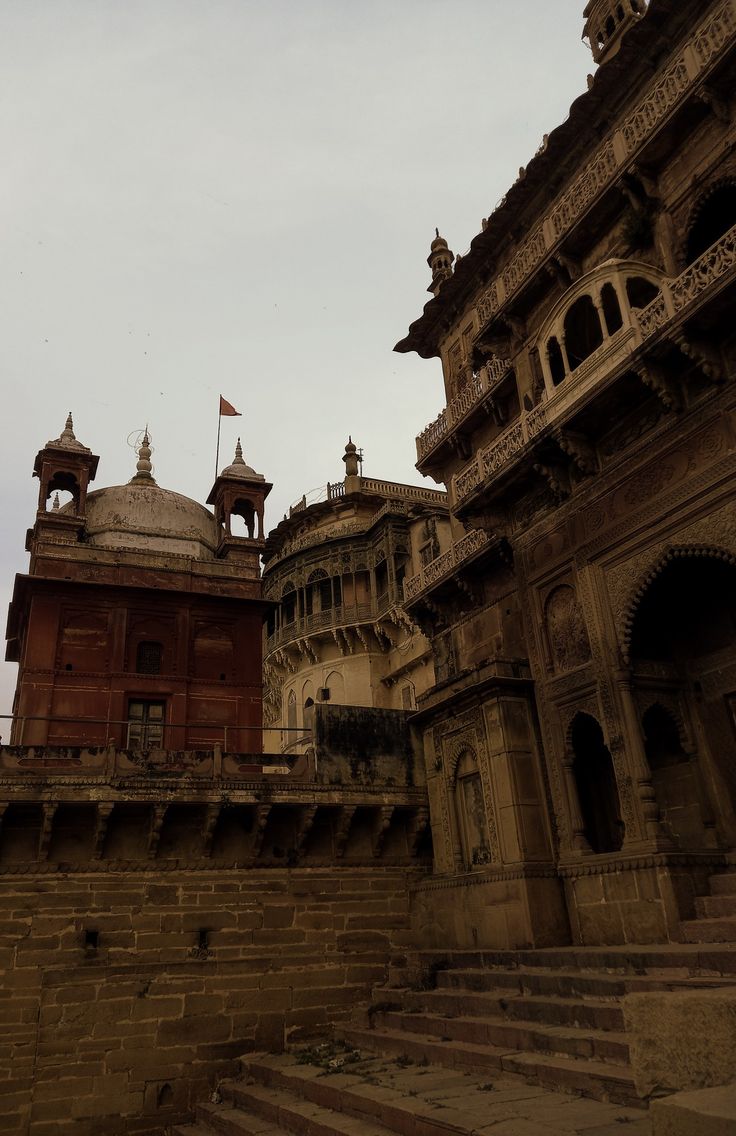 an old building with two towers on top