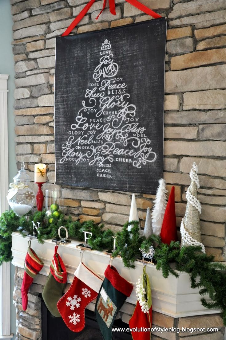 a fireplace decorated for christmas with stockings and stockings hanging from the mantle