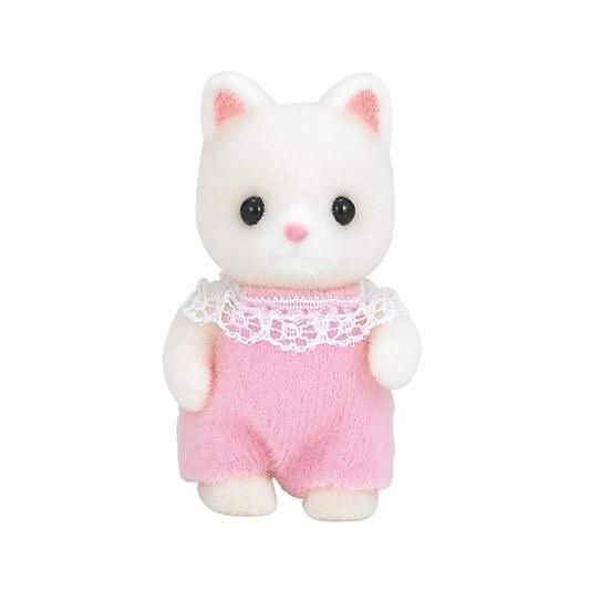 a small white cat with pink clothes on it's chest and black eyes is standing in front of a white background