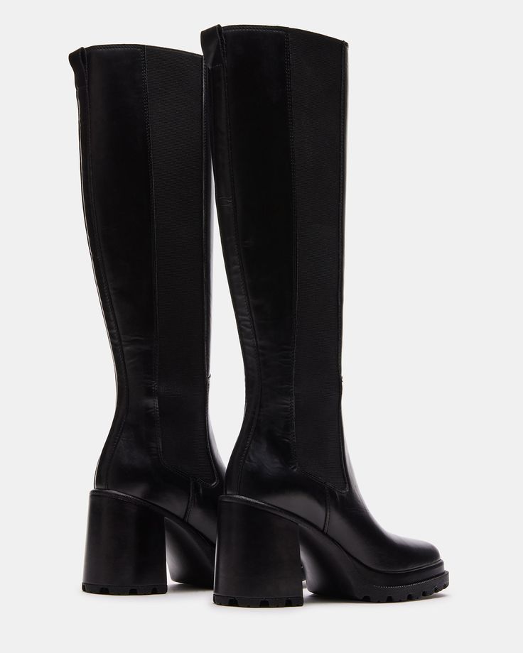 CHIC + FIERCE + POLISHED The ALESTI square toe knee boot gives you the ultimate defined fit with stretch panels on either side of the boot. A treaded block heel and platform sole ensure a comfortable and secure step. Square toe block heel knee boot Pull-on style with stretch gores and back pull loop Full length stretch fabric gore on each side Treaded block heel and platform sole 3.25 inch heel height 1 inch platform Size 6 measurements: 13.25 inch shaft circumference, 15 inch shaft height Size Knee-high Platform Boots With Wide Calf And Lug Sole, Wide Calf Knee-high Platform Boots With Lug Sole, Knee-high Boots With Lug Sole, Medium Width Knee-high Boots With Lug Sole, Knee-high Chunky Platform Heeled Boots Medium Width, Knee-high Boots With Chunky Platform And Wide Calf, Leather Knee-high Boots With Chunky Platform And Wide Calf, Leather Knee-high Boots With Wide Calf And Chunky Platform, Knee-high Platform Heeled Boots