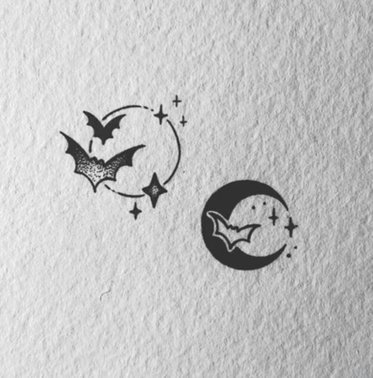 two bats flying over the moon and stars