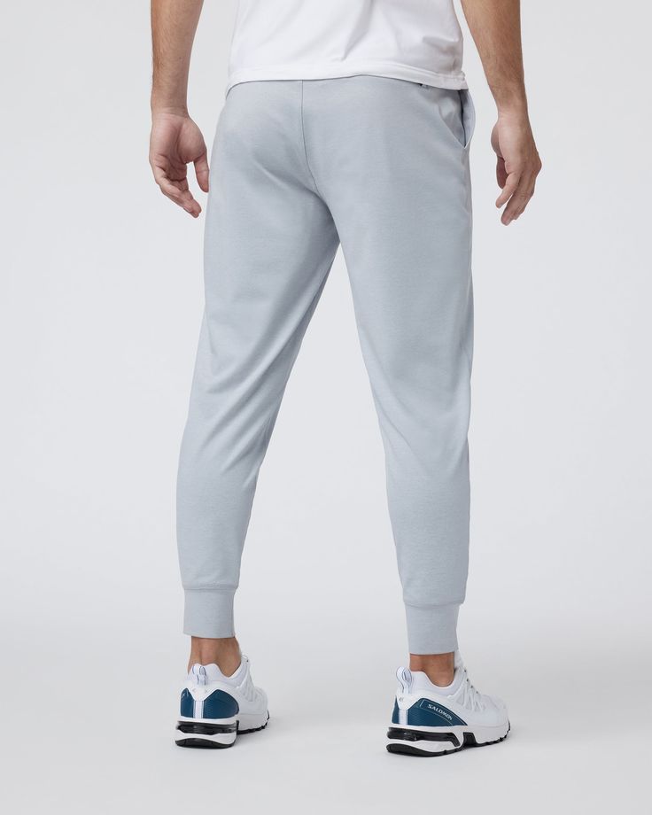 A fresh take on athleisure and a staple in your wardrobe, the Sunday Performance Joggers are premier in fit, function and soft stretch. This jogger style will keep you moving with less bulk around your ankles. | Vuori Sunday Performance Jogger Pants | Platinum Heather | Medium Vuori makes premium performance apparel inspired by the active Coastal California lifestyle; an integration of fitness, surf, sport, and art. Breaking down the boundaries of traditional activewear, we are a new perspective Sporty Tapered Leg Joggers For Jogging, Sporty Joggers With Comfort Stretch And Tapered Leg, Sportswear Pants With Ribbed Cuffs For Workout, Athleisure Joggers With Ribbed Cuffs, Comfortable Activewear For Jogging With Ribbed Cuffs, Stretch Joggers With Ribbed Cuffs For Workout, Sporty Tapered Leg Sweatpants With Comfort Stretch, Athleisure Sports Bottoms With Ribbed Cuffs, Athleisure Sweatpants With Ribbed Cuffs For Sports