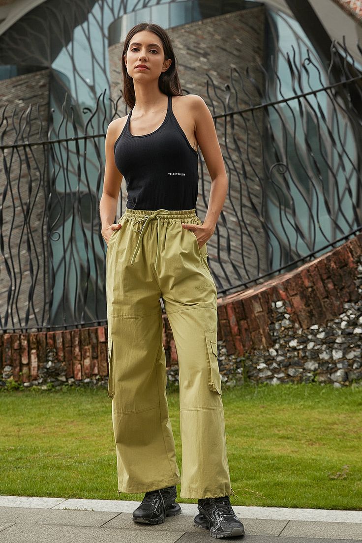 This pant is ready to ignite. The Trouser Pant in soft cotton features a roomy, wide leg fit with cargo pocket detailing, side pockets and a elastic waistband with drawstring. Pair it up with a matching jacket or wear on its own with fave kicks. Athleisure Women, Yoga Set, Cargo Pocket, Trouser Pants, Sweater Coats, Bra Tops, Dress Accessories, Hoodie Shirt, Short Dresses