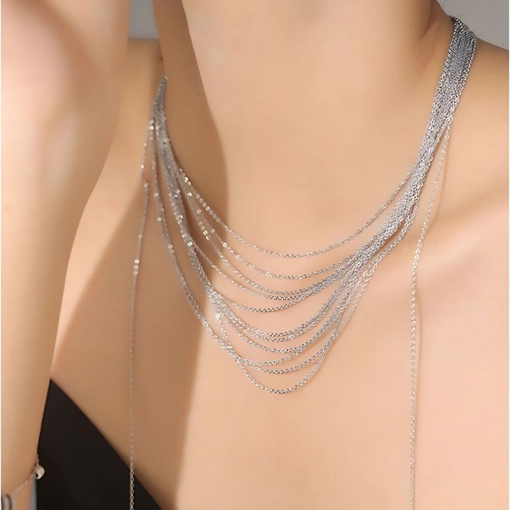 ✦ Transform your wardrobe with this Multistrand Silver Tassel Chain Necklace. Accessorize with this elegant yet simple piece for a bold and daring look. Perfect for a night out, this necklace will take your outfit to the next level. Despite the absence of diamonds, this eye-catching piece will make you shine at any party! ----------- DETAILS ----------- - Color: Silver - Materials: Brass - Necklace Length: 42.3cm - SKU: HN2699 Trendy Lariat Choker Necklace For Party, Choker Chain Jewelry For Night Out, Silver Box Chain Jewelry For Party, Elegant Double Chain Necklace For Party, Metal Choker Drop Necklace For Party, Metal Drop Choker Necklace For Party, Trendy Dangle Necklaces For Party, Metal Drop Necklace For Party, Multi-strand Delicate Chain Necklace For Party