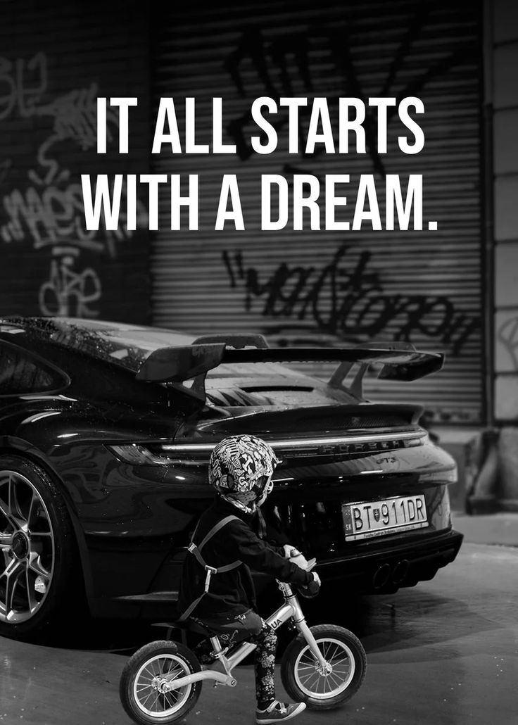 a little boy riding a bike next to a car with the words it all starts with a dream