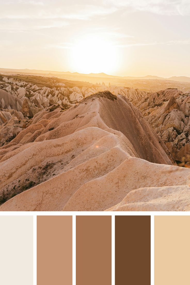 the sun is setting over some rocks in the desert, and there are many colors to choose from