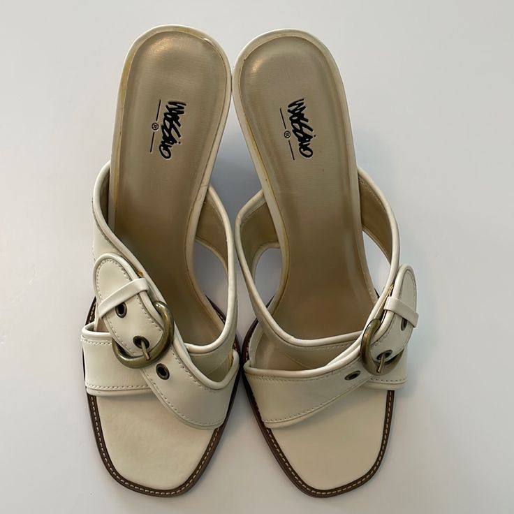 Mossimo Slip-On Heeled Sandals. Size 9. Never Worn. Elevate Your Outfit With These Gorgeous Ivory Leather Upper Sandals With Brushed Gold Hardware For Style & Sophistication. Small Imperfection On Left Heel (See Photo). Casual Cream Block Heel Heels, Casual Cream Block Heels, Casual Cream High Heels, Trendy Cream Sandals With Padded Heel, Cream High Heel Casual Sandals, Casual Cream High Heel Sandals, Casual White Heels With Buckle Closure, Cream Wedge Heel Sandals For Day Out, White Mules With Heel Loop For Spring