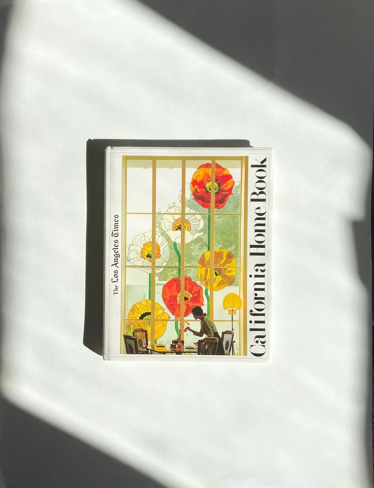 an image of a card with flowers on it in front of a window that says california poppys