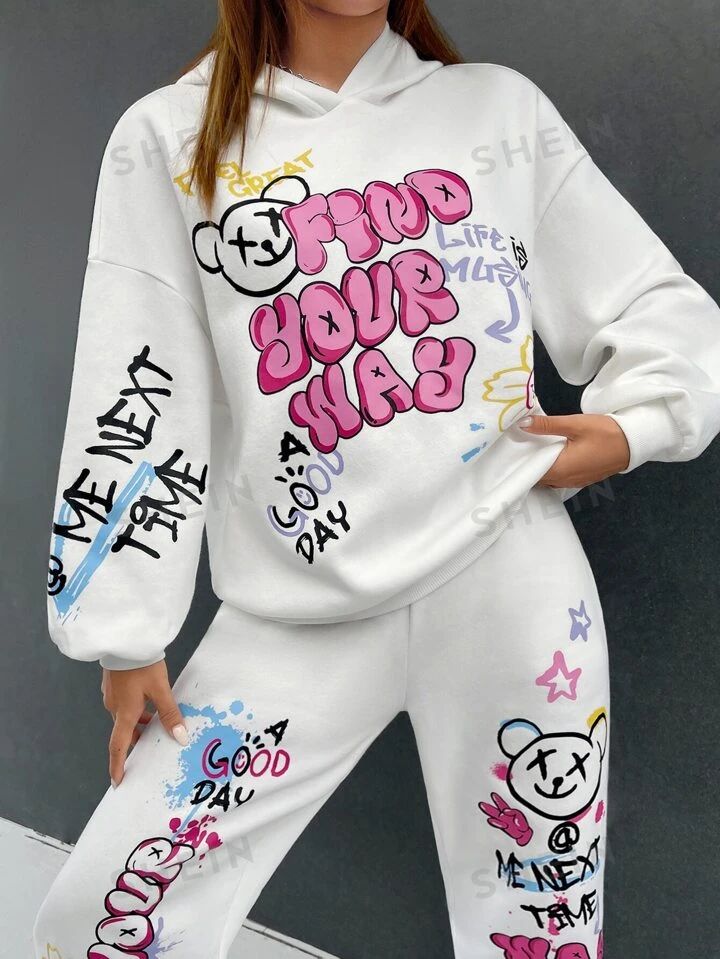 SHEIN EZwear Cartoon & Slogan Graphic Drop Shoulder Hoodie & Sweatpants | SHEIN USA Trendy White Sweats For Leisure, Oversized Long Sleeve Graffiti Sweatshirt, White Graphic Print Long Sleeve Sweats, Graphic Print Hoodie For Loungewear, Graphic Print Hoodie Sweats For Loungewear, White Long Sleeve Sweats With Graphic Print, White Letter Print Hoodie Sweats, Cotton Graffiti Print Long Sleeve Sweatshirt, White Hoodie Sweatshirt For Leisure