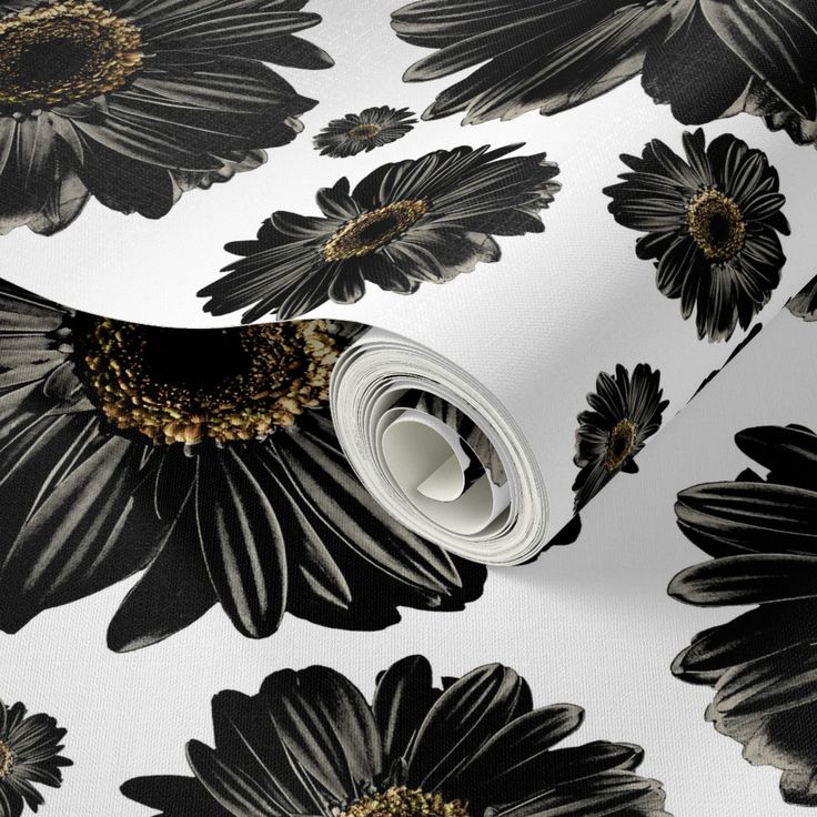 black and white floral wallpaper with large flowers on the back ground, in front of a white background